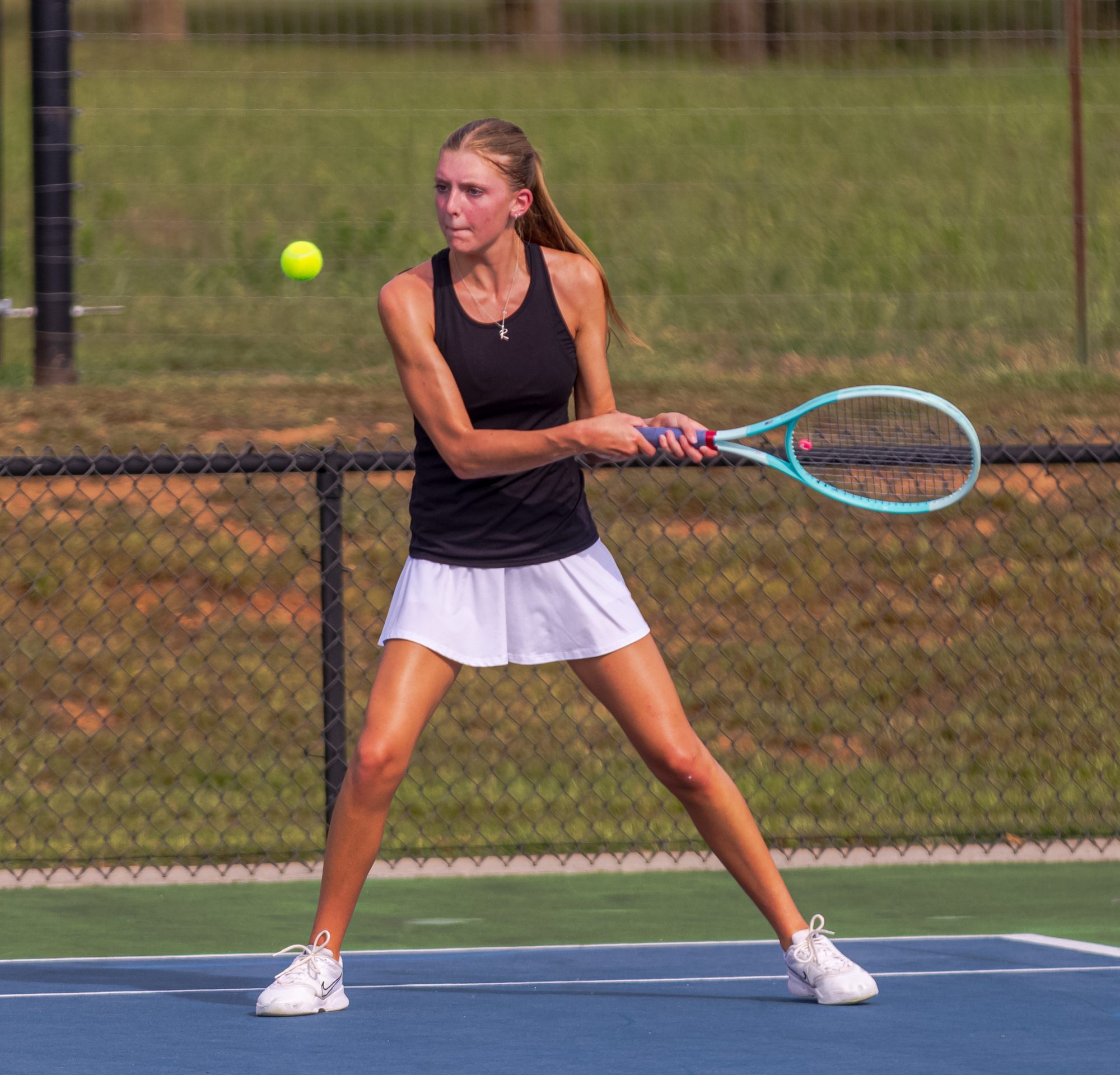Abbi Bremer lines up a two-handed backhand
