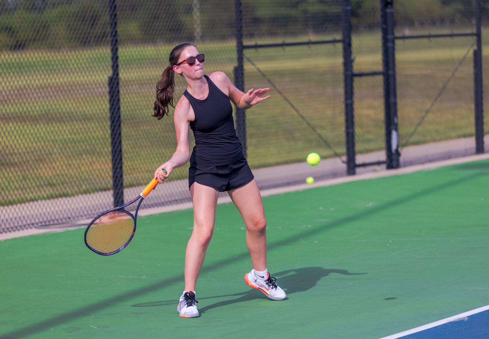 Claire Norris hits a forehand