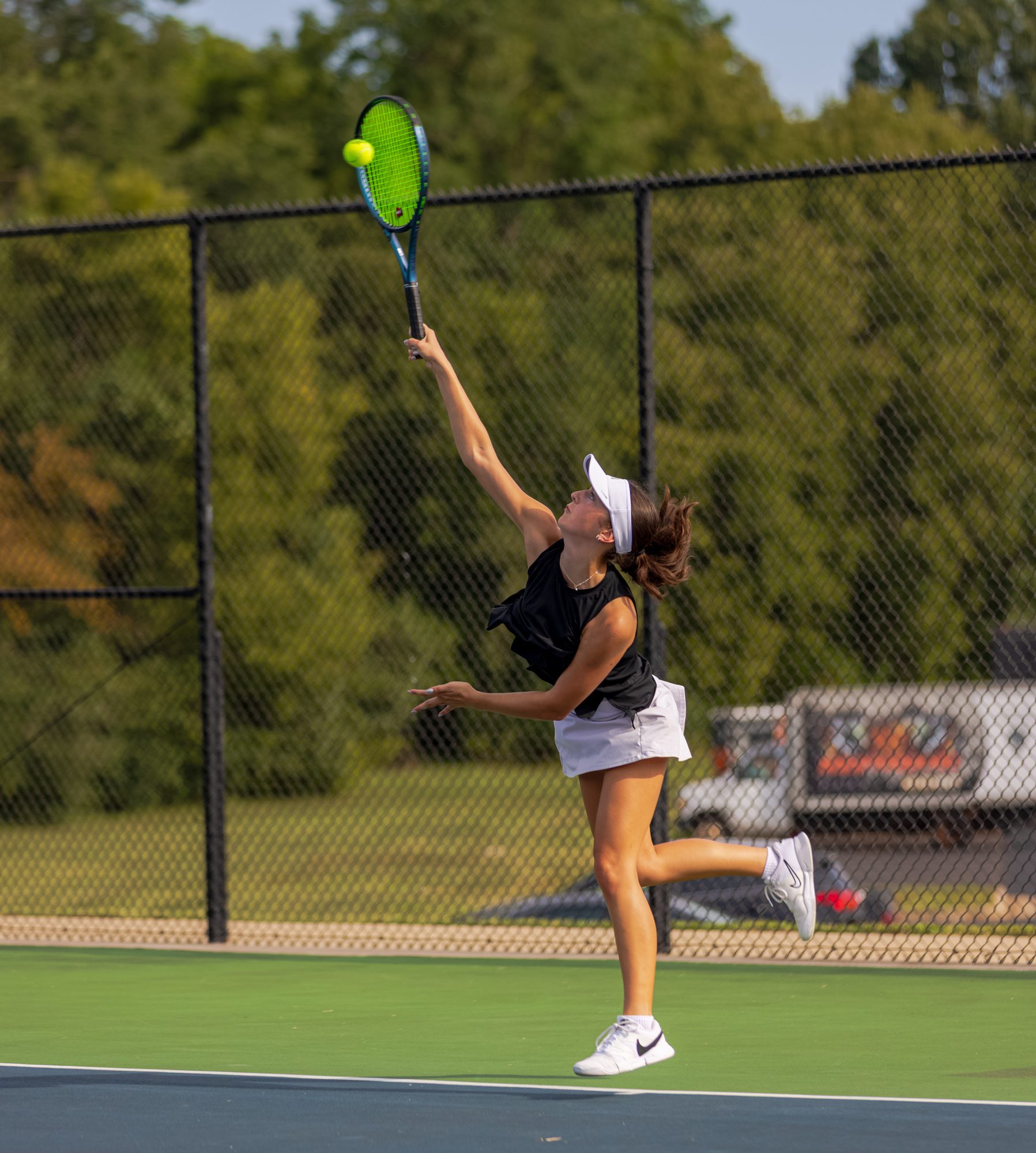 Marlee Vasquez reaches for an overhead