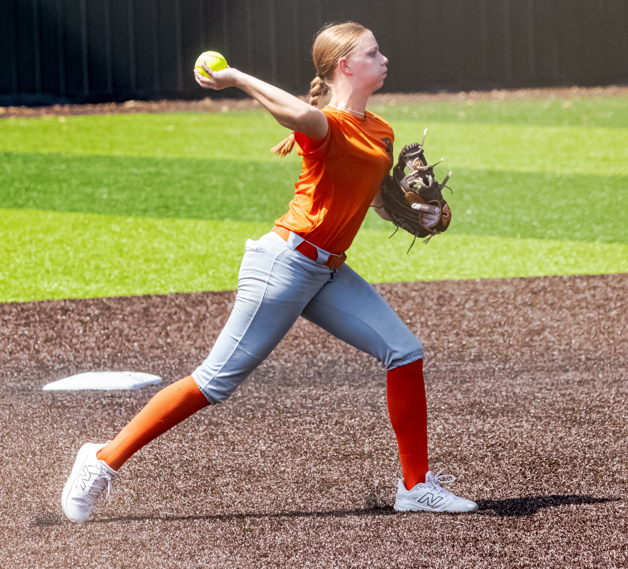 Emma Ellison throws from the infield