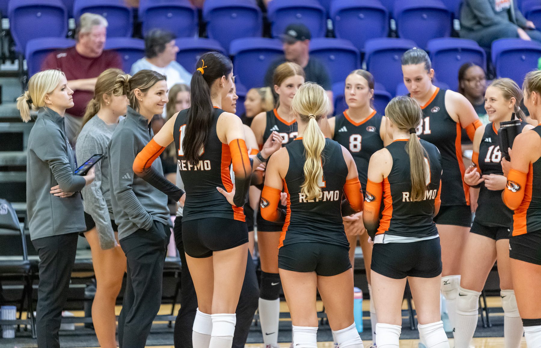 Coach Allison Davis talks to the Lady Tigers in a huddle