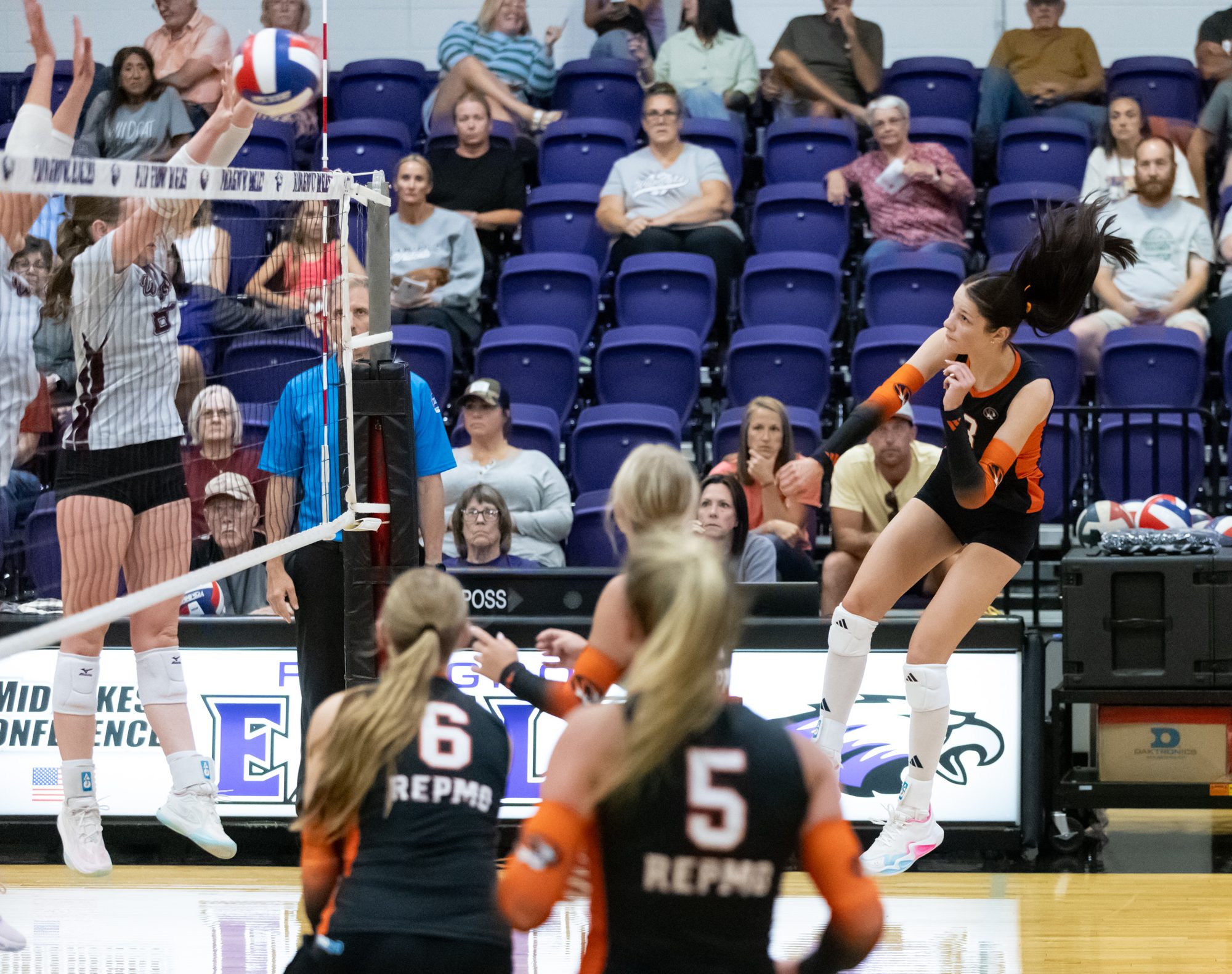 Kate Mitchell follows through on an attack at the net